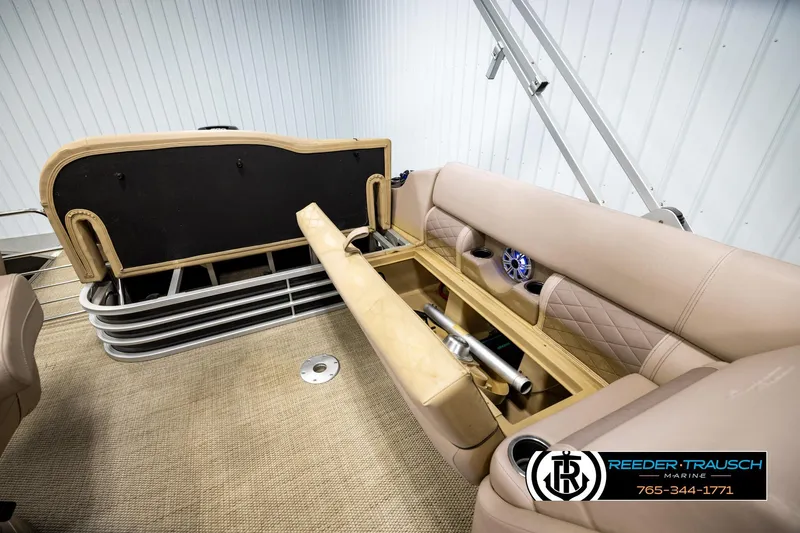 Slide: The Image of 2018 Bennington 24 SSBXPDL pontoon boat interior with storage compartment open. - 24
