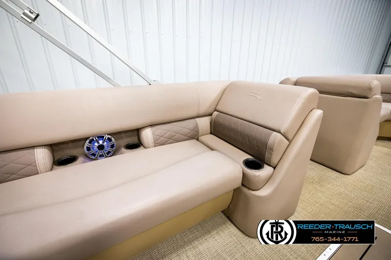 Slide: The Image of Luxurious seating on a 2018 Bennington 24 SSBXPDL pontoon boat with cup holders and speaker. - 25