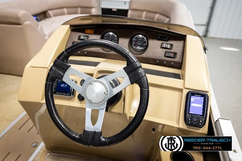 Slide: The Image of Steering console of a 2018 Bennington 24 SSBXPDL pontoon boat with modern controls. - 32