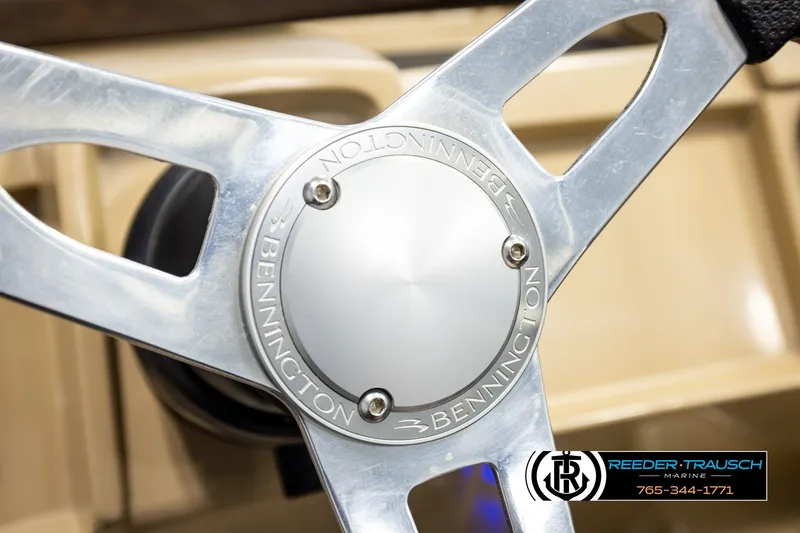 Slide: The Image of Steering wheel of 2018 Bennington 24 SSBXPDL boat, featuring Reeder-Trausch Marine logo. - 34