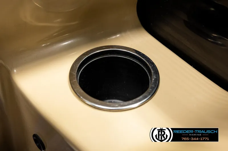 Slide: The Image of Cup holder on 2018 Bennington 24 SSBXPDL boat interior, Reeder-Trausch Marine logo visible. - 38
