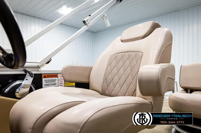Slide: The Image of Luxurious captain's chair on 2018 Bennington 24 SSBXPDL pontoon boat, featuring beige upholstery. - 40