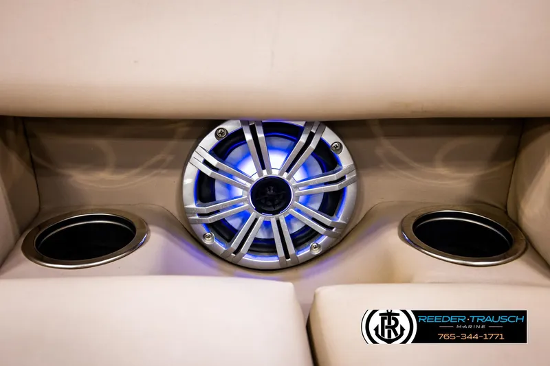 Slide: The Image of Speaker and cup holders on 2018 Bennington 24 SSBXPDL boat interior. - 43