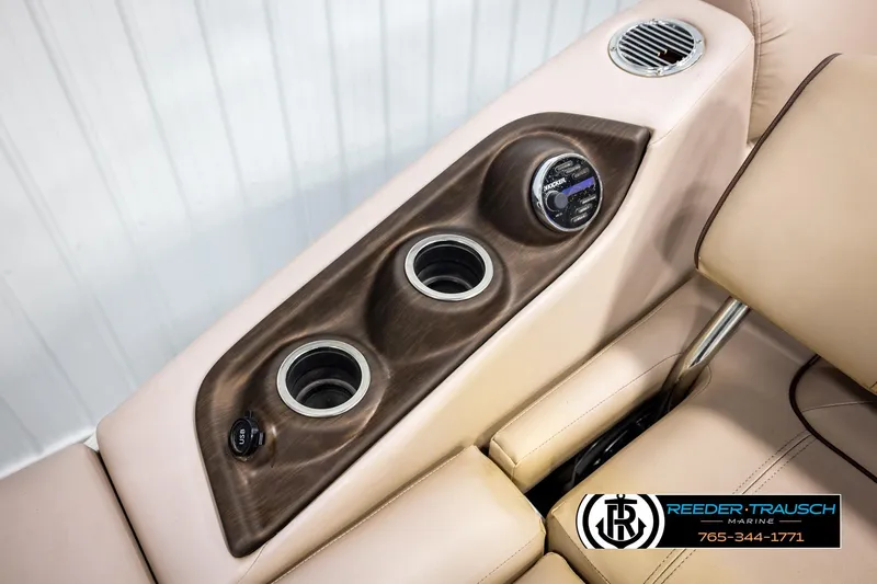 Slide: The Image of 2018 Bennington 24 SSBXPDL boat interior with cup holders and USB port. - 45