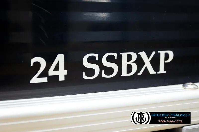 Slide: The Image of 2018 Bennington 24 SSBXPDL boat model lettering on dark surface. - 52