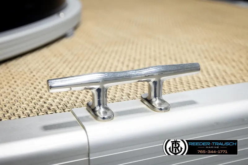 Slide: The Image of Chrome cleat on 2018 Bennington 24 SSBXPDL boat deck, Reeder-Trausch Marine logo visible. - 56