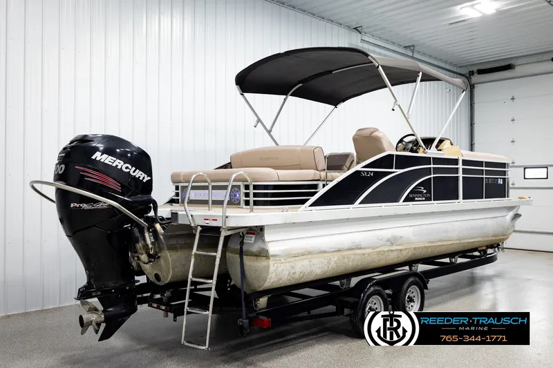 Slide: The Image of 2018 Bennington 24 SSBXPDL pontoon boat with Mercury engine in indoor showroom. - 6