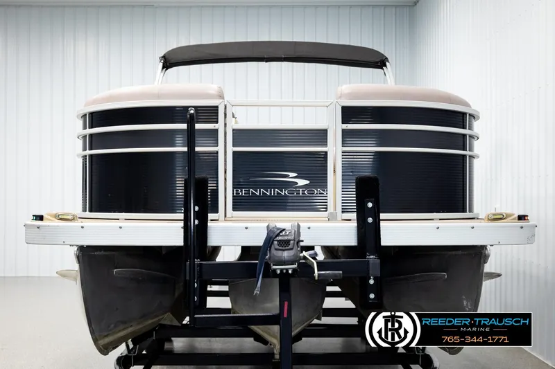 Slide: The Image of 2018 Bennington 24 SSBXPDL pontoon boat on trailer in indoor storage. - 8