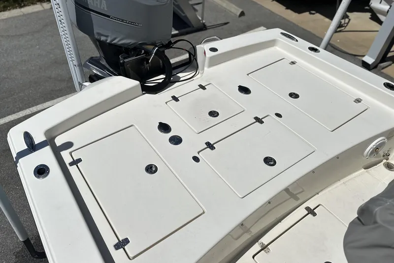 Slide: The Image of 2014 Pathfinder 2600 HPS boat deck with storage compartments and Yamaha outboard motor. - 10