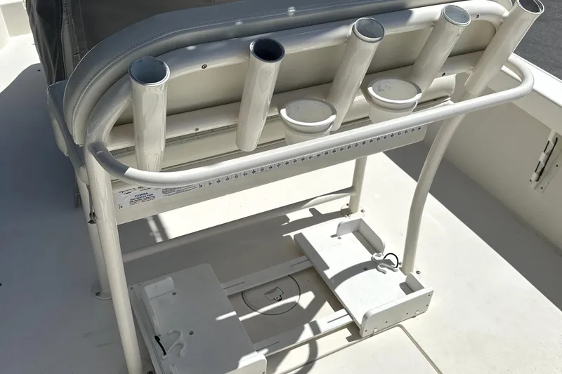 Slide: The Image of 2014 Pathfinder 2600 HPS boat with rod holders and storage compartments. - 11
