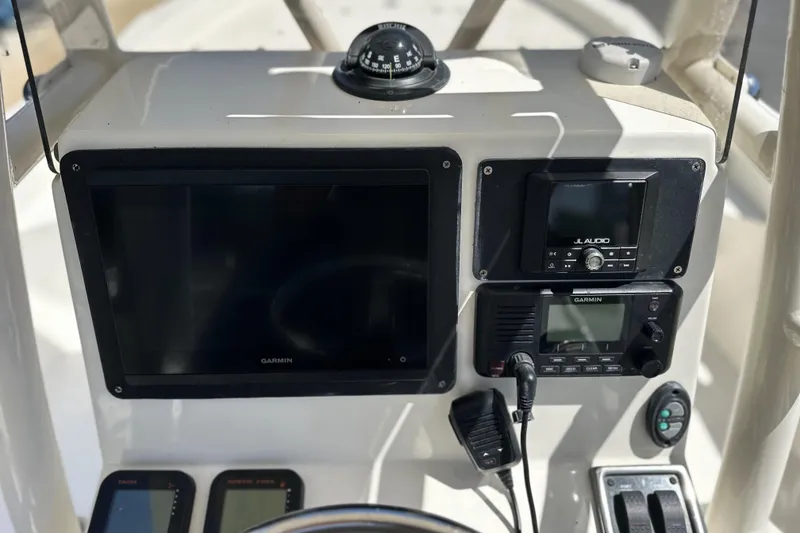 Slide: The Image of Control panel of a 2014 Pathfinder 2600 HPS boat with Garmin and JL Audio equipment. - 12