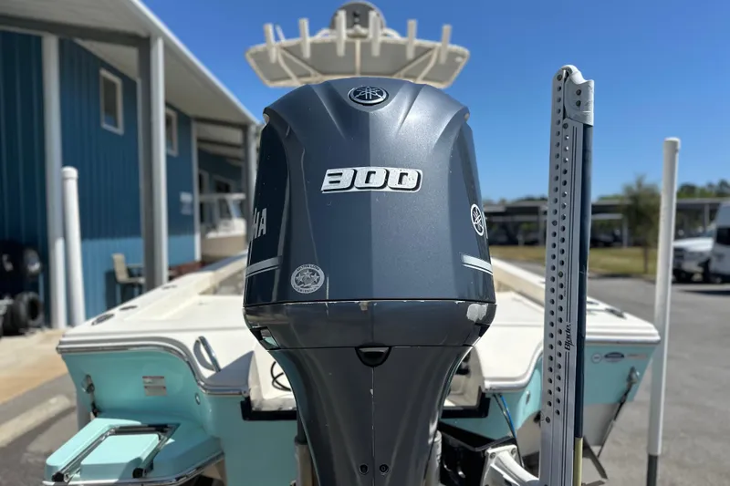 Slide: The Image of 2014 Pathfinder 2600 HPS boat with Yamaha 300 outboard motor, parked outdoors. - 8
