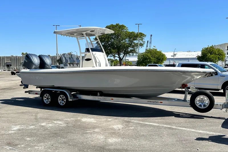 The Image of 2023 ShearWater 270 Carolina Flare boat on trailer outdoors. - 0
