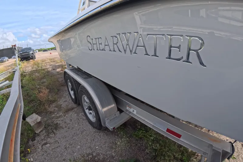 Slide: The Image of 2023 ShearWater 270 Carolina Flare boat on trailer, side view. - 10