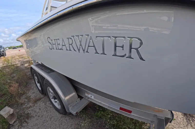 Slide: The Image of 2023 ShearWater 270 Carolina Flare boat on trailer, side view. - 12