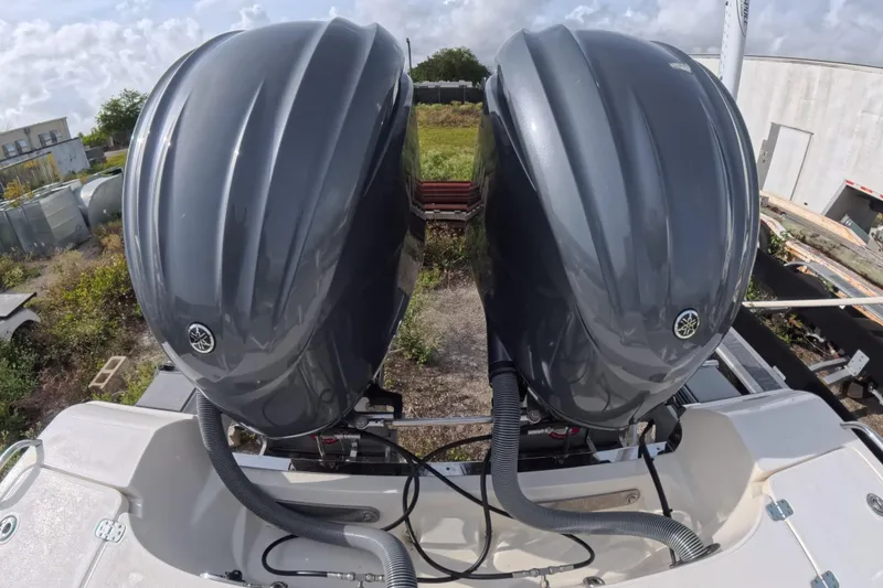 Slide: The Image of Twin outboard motors on a 2023 ShearWater 270 Carolina Flare boat. - 13