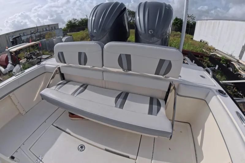Slide: The Image of 2023 ShearWater 270 Carolina Flare boat with dual engines and seating area. - 15