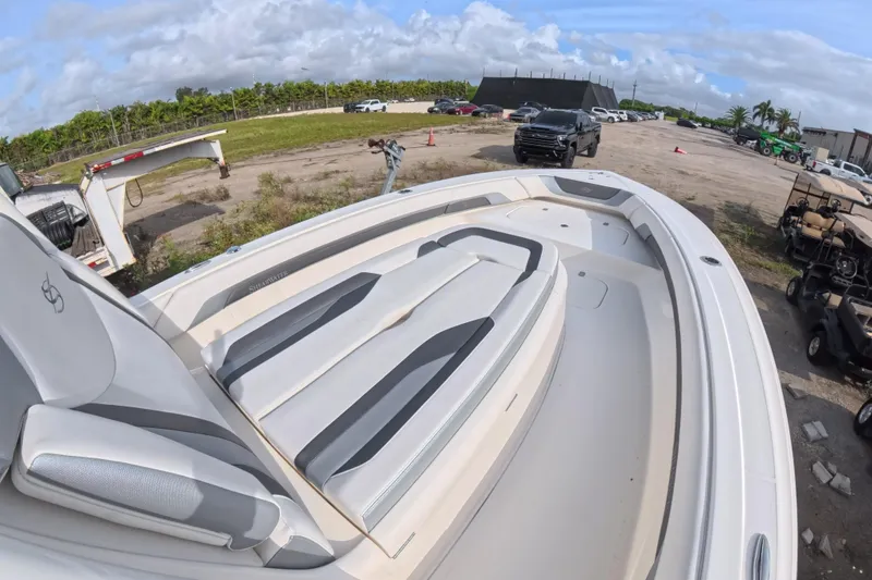 Slide: The Image of 2023 ShearWater 270 Carolina Flare boat with sleek seating, parked outdoors. - 18