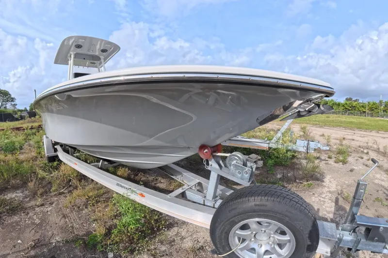 Slide: The Image of 2023 ShearWater 270 Carolina Flare boat on trailer, side view, outdoors. - 2
