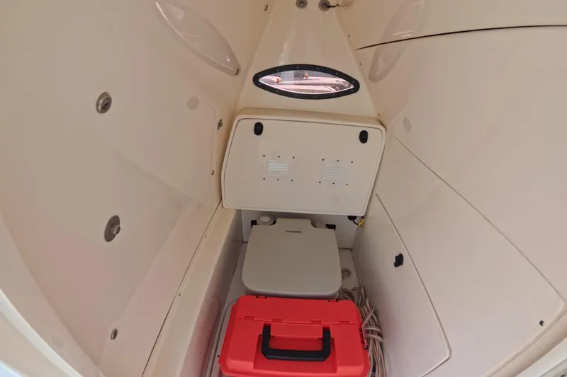 Slide: The Image of Interior cabin of 2023 ShearWater 270 Carolina Flare boat with storage and equipment. - 23