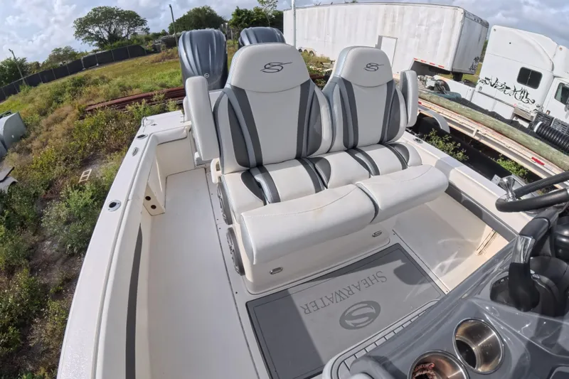 Slide: The Image of 2023 ShearWater 270 Carolina Flare boat interior with stylish seating and logo mat. - 24