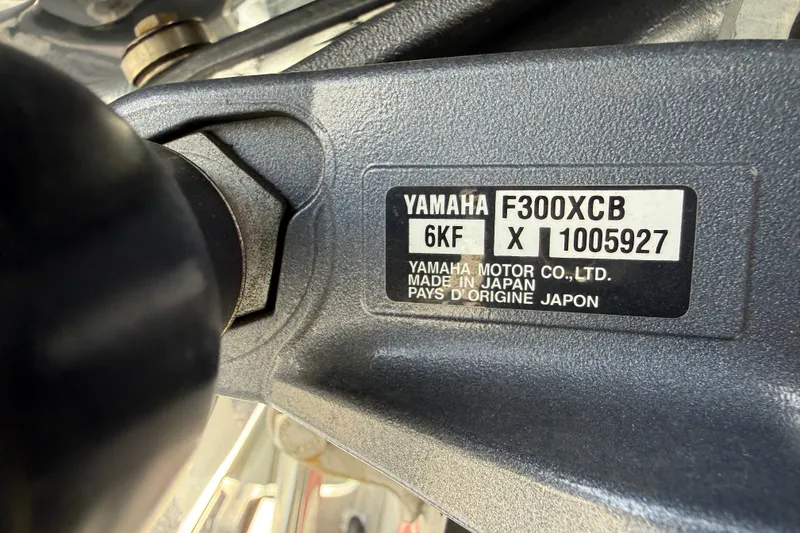 Slide: The Image of Close-up of Yamaha F300XCB engine label on 2023 ShearWater 270 Carolina Flare boat. - 28
