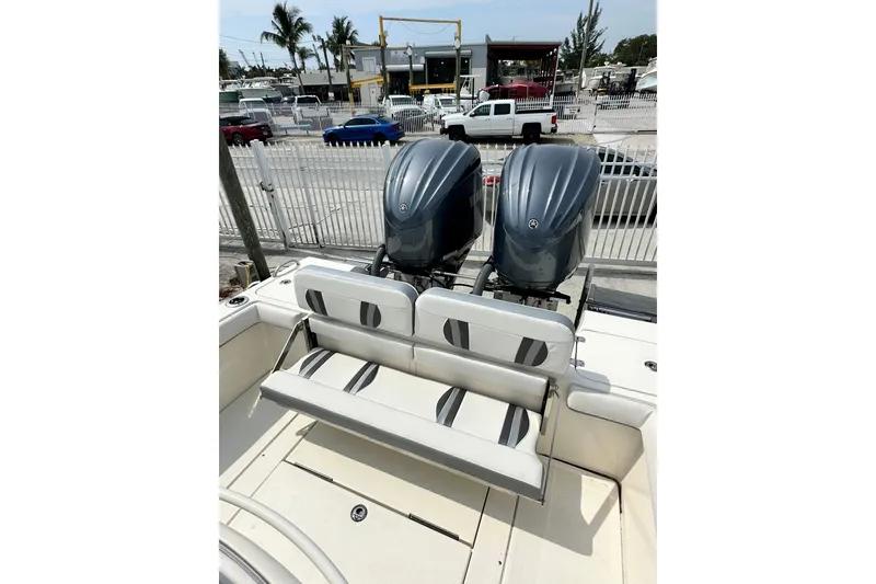Slide: The Image of 2023 ShearWater 270 Carolina Flare boat with dual outboard engines and seating. - 33