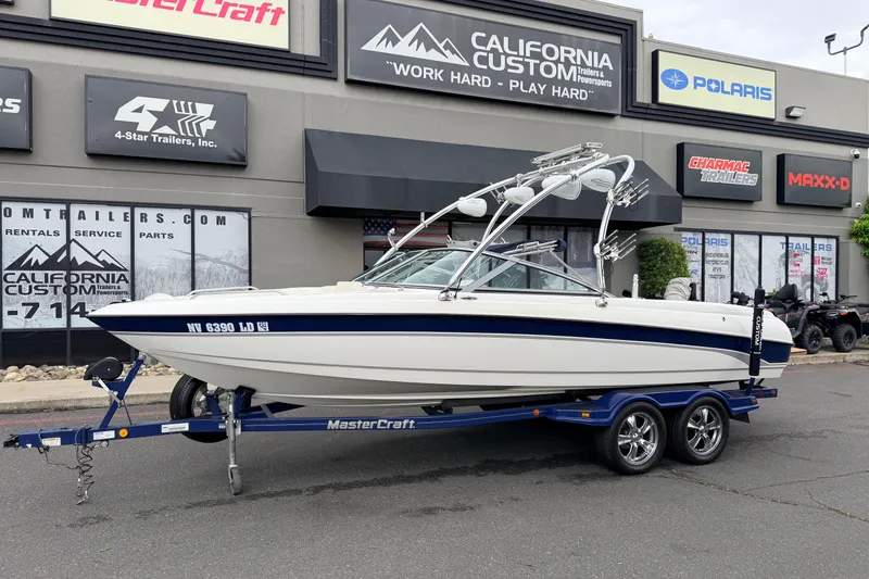 The Image of 2005 MasterCraft MariStar 230 VRS boat on trailer outside California Custom store. - 0