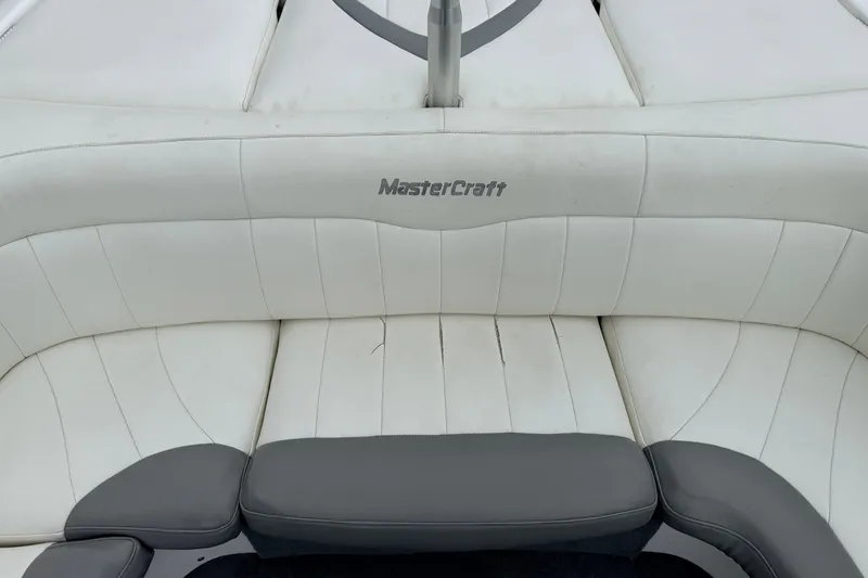 Slide: The Image of 2005 MasterCraft MariStar 230 VRS boat interior with white and gray seating. - 12