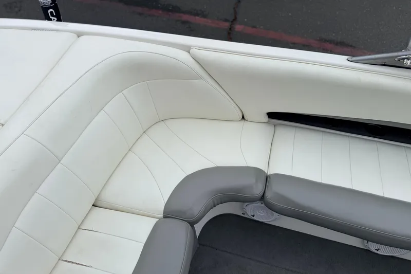 Slide: The Image of 2005 MasterCraft MariStar 230 VRS boat interior with white and gray seating. - 13