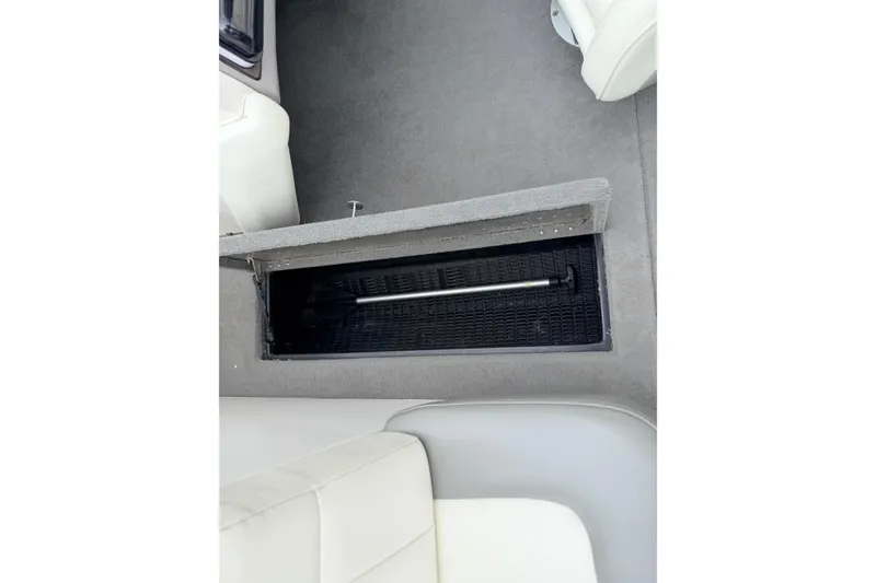 Slide: The Image of 2005 MasterCraft MariStar 230 VRS interior storage compartment with open hatch. - 19