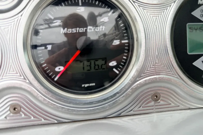 Slide: The Image of Close-up of a 2005 MasterCraft MariStar 230 VRS tachometer displaying 136.2 RPM. - 21