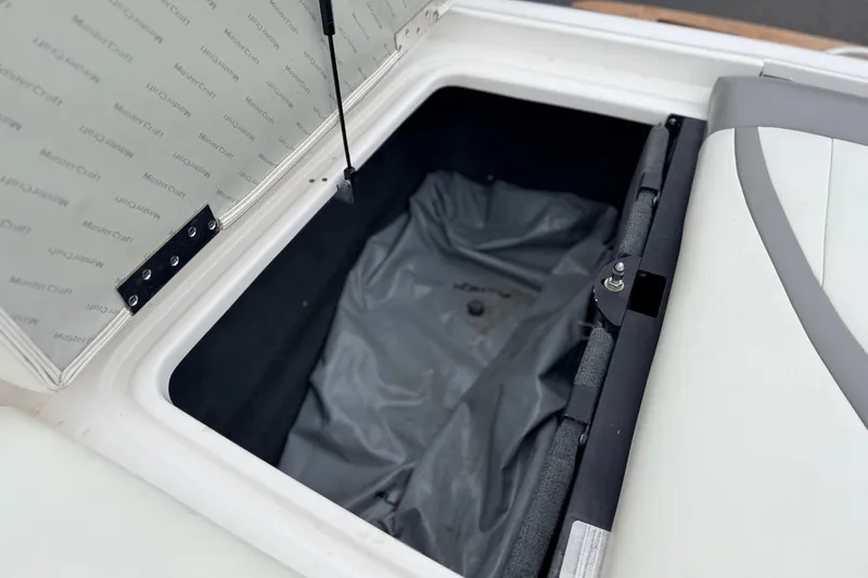 Slide: The Image of Open storage compartment of 2005 MasterCraft MariStar 230 VRS boat. - 22