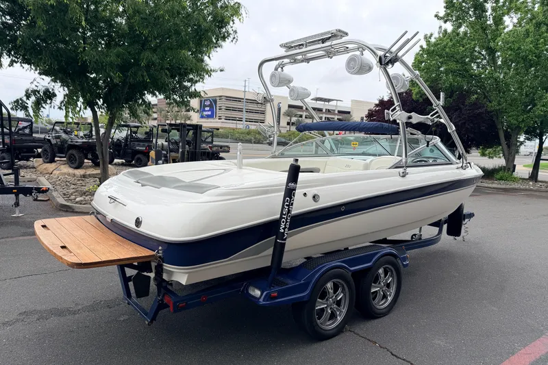 Slide: The Image of 2005 MasterCraft MariStar 230 VRS boat on trailer, parked outdoors. - 5