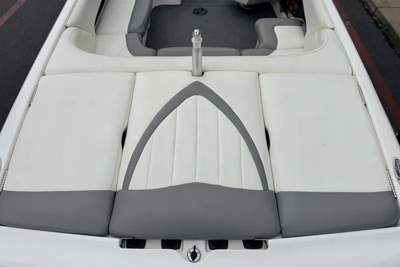 Slide: The Image of 2005 MasterCraft MariStar 230 VRS boat interior with white and gray seating. - 9