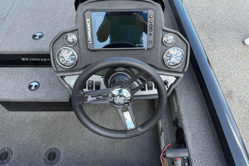 Slide: The Image of 2023 Ranger RT188P boat dashboard with steering wheel and Lowrance Elite display. - 10