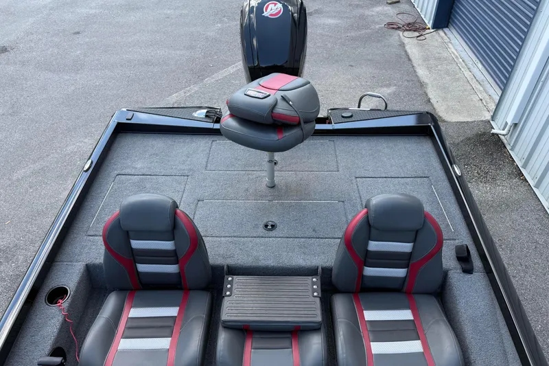 Slide: The Image of 2023 Ranger RT188P boat interior with gray and red seating, carpeted deck. - 12