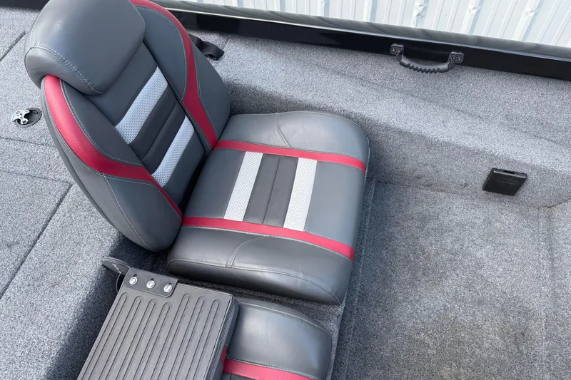 Slide: The Image of 2023 Ranger RT188P boat seat with gray and red upholstery, on a carpeted deck. - 13