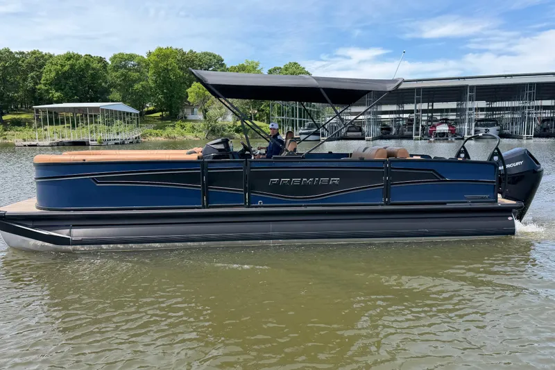 The Image of 2026 Premier 250 Intrigue RLO pontoon boat cruising on a lake with canopy. - 0