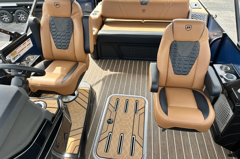 Slide: The Image of Interior of 2026 Premier 250 Intrigue RLO boat with luxurious tan seating. - 10