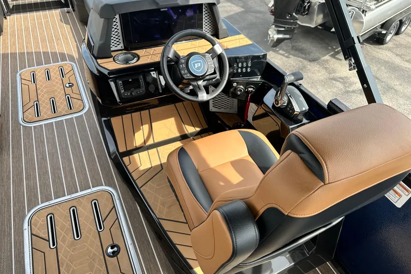 Slide: The Image of Luxurious interior of 2026 Premier 250 Intrigue RLO boat with modern helm and seating. - 17