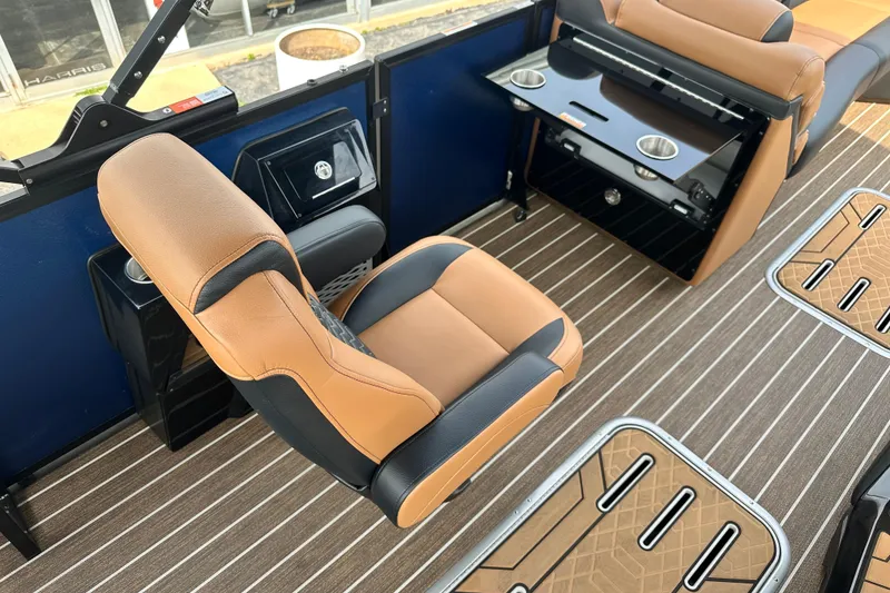Slide: The Image of Luxurious interior of 2026 Premier 250 Intrigue RLO boat with tan seating and striped flooring. - 19