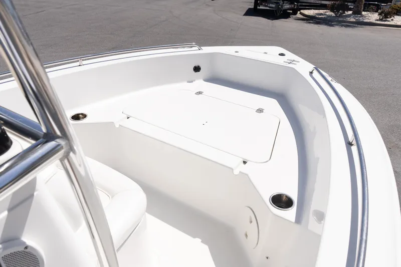 Slide: The Image of 2012 Sea Hunt Triton 188 boat interior with storage compartment and stainless steel railing. - 14