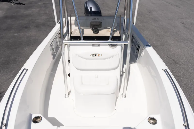 Slide: The Image of 2012 Sea Hunt Triton 188 boat interior with steering console and seating. - 16