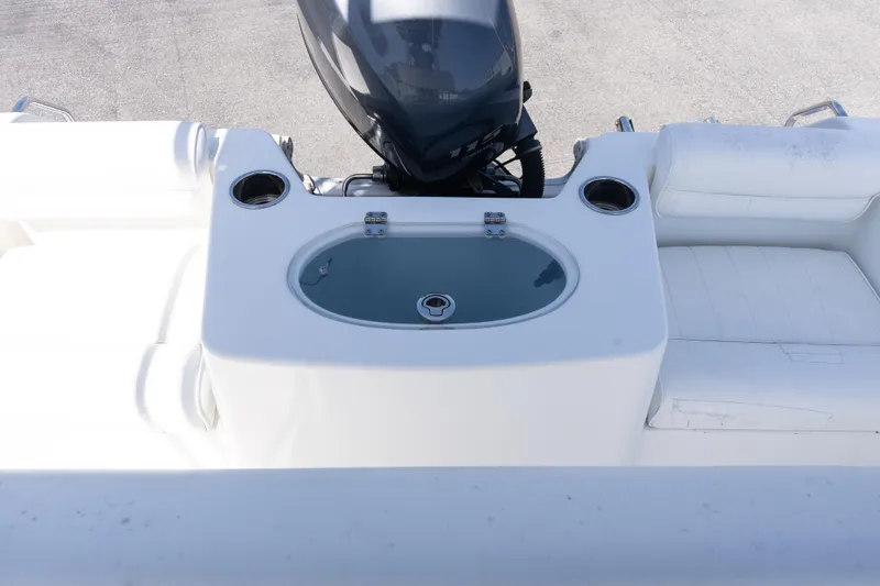 Slide: The Image of 2012 Sea Hunt Triton 188 boat interior with livewell and seating area. - 7