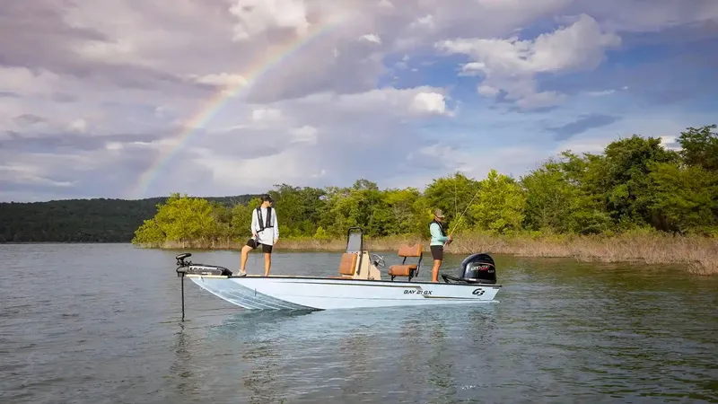 Slide: The Image of G3 Bay 21 GX boat 2026 under rainbow on lake. - 22
