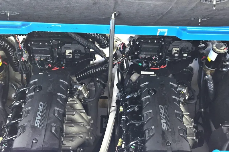 Slide: The Image of Twin engines of a 2022 Yamaha Boats 255XD, showcasing intricate wiring and components. - 10