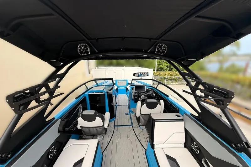 Slide: The Image of Interior view of 2022 Yamaha Boats 255XD, featuring sleek seating and modern controls. - 21