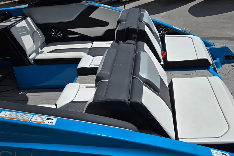 Slide: The Image of 2022 Yamaha Boats 255XD interior with sleek, modern seating and stylish design. - 23