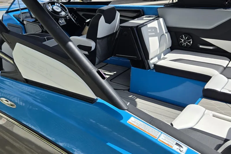 Slide: The Image of Interior of 2022 Yamaha Boats 255XD, featuring sleek seating and modern design elements. - 24